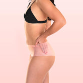 Lorals model Ahyoka demonstrates the profile view and transparent material of Pleasure Undies in Sheer Peach Shortie Style