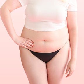 Lorals model Amanda demonstrates the front view of Pleasure Undies in Black Bikinis