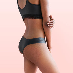 Lorals model Gladys demonstrates the back view of Pleasure Undies in Black Bikinis