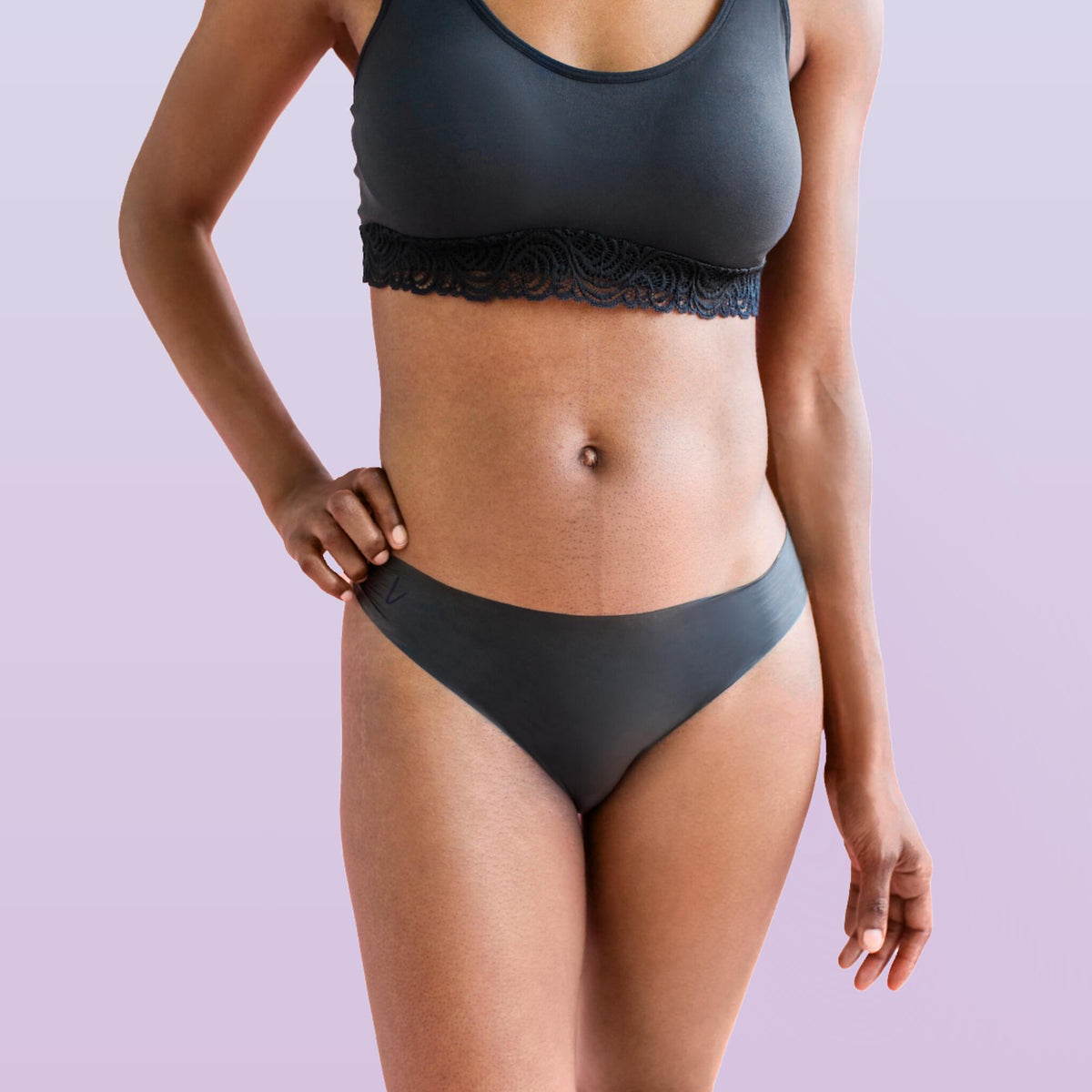 Lorals model Gladys demonstrates the front view of Protection Undies in Black Bikinis