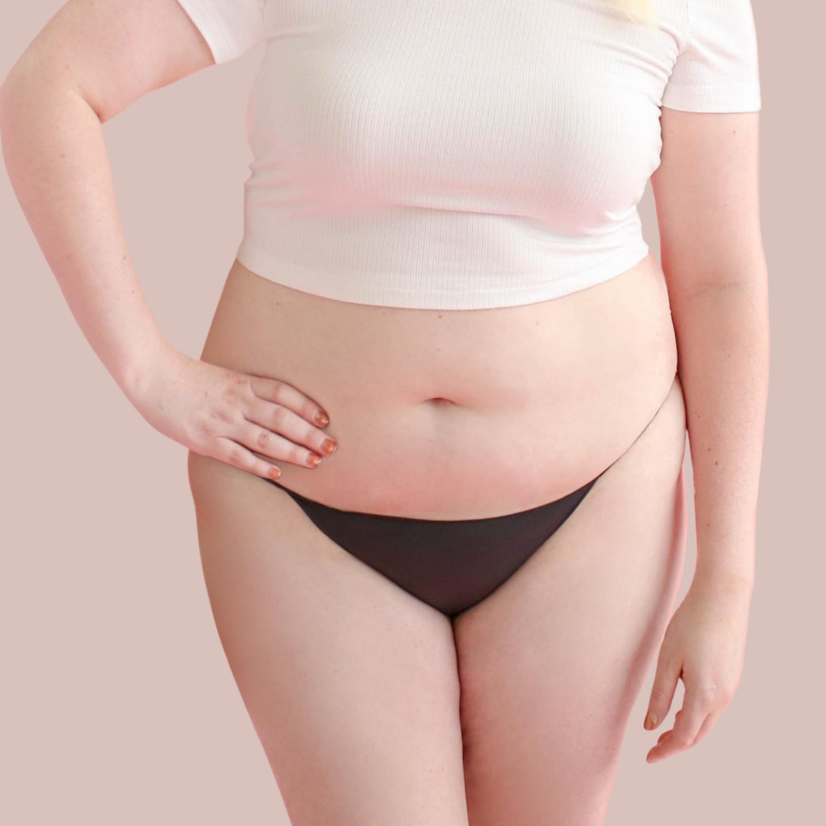 Lorals model Amanda demonstrates the front view of Pleasure Undies in Black Bikinis