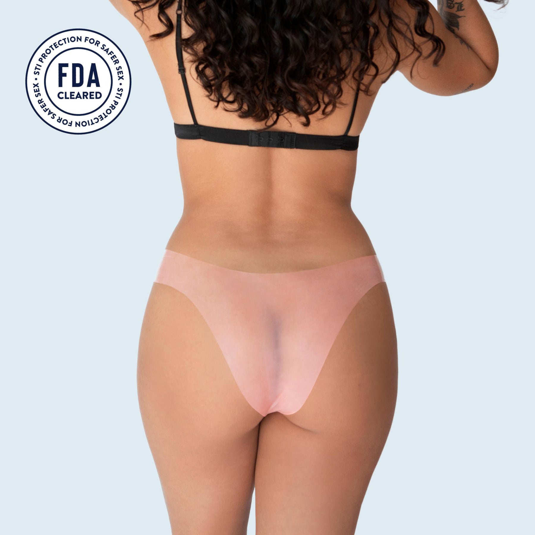 Lorals model Ahyoka demonstrates the back view of Protection Bikini Panties in Sheer