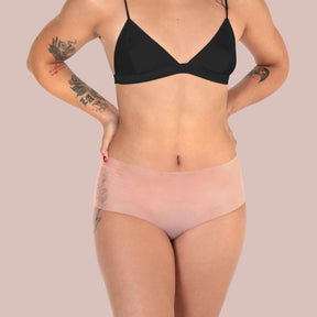 Lorals model Ahyoka demonstrates the front view of Pleasure Shortie Panties in Sheer